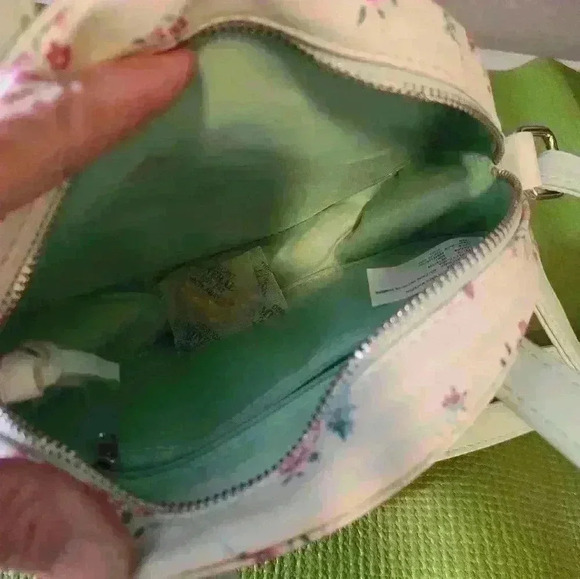 Mint green with detail silk lining.Round Purse with over shoulder and hand strap - Picture 8 of 10